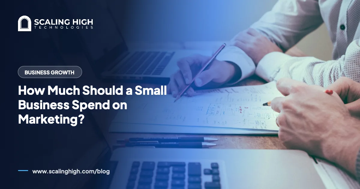 Pocket calculator and a handwritten budget worksheet on a wooden desk beside a cup of coffee